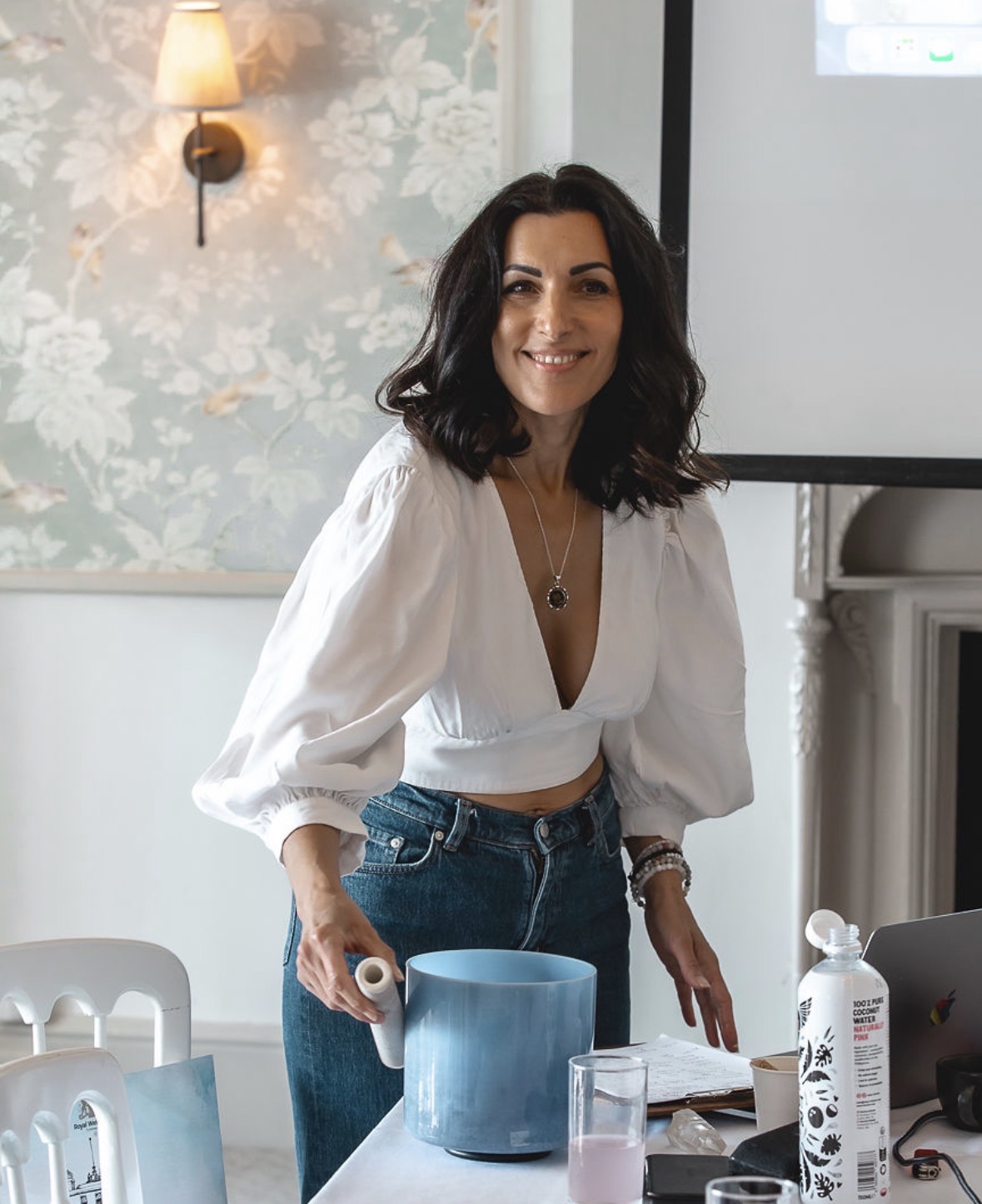 Naomi Buff leading a workshop with a crystal singing bowl